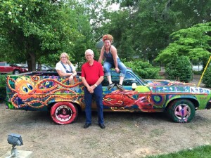 Artists Mary Frances Hull and Fox Gradin with Allen McClure painted the Quinlan’s Art Car at the opening of HOMEFOLK.